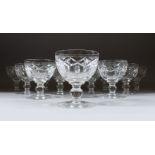 A SET OF TWELVE CUT CRYSTAL WINE GLASSES.