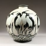 A LARGE DECO TYPE VASE decorated with penguins. 12ins high.