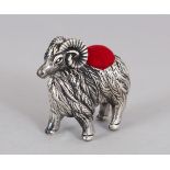 A SILVER RAM PIN CUSHION.