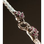 A SILVER MARCASITE RUBY SET PANTHER BRACELET.