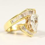 A VERY SUBSTANTIAL 18CT YELLOW GOLD PEAR SHAPED DIAMOND RING of 2cts, the shoulders flanked by