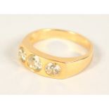 AN 18CT YELLOW GOLD THREE STONE GENTS DIAMOND RING of 1.9cts.