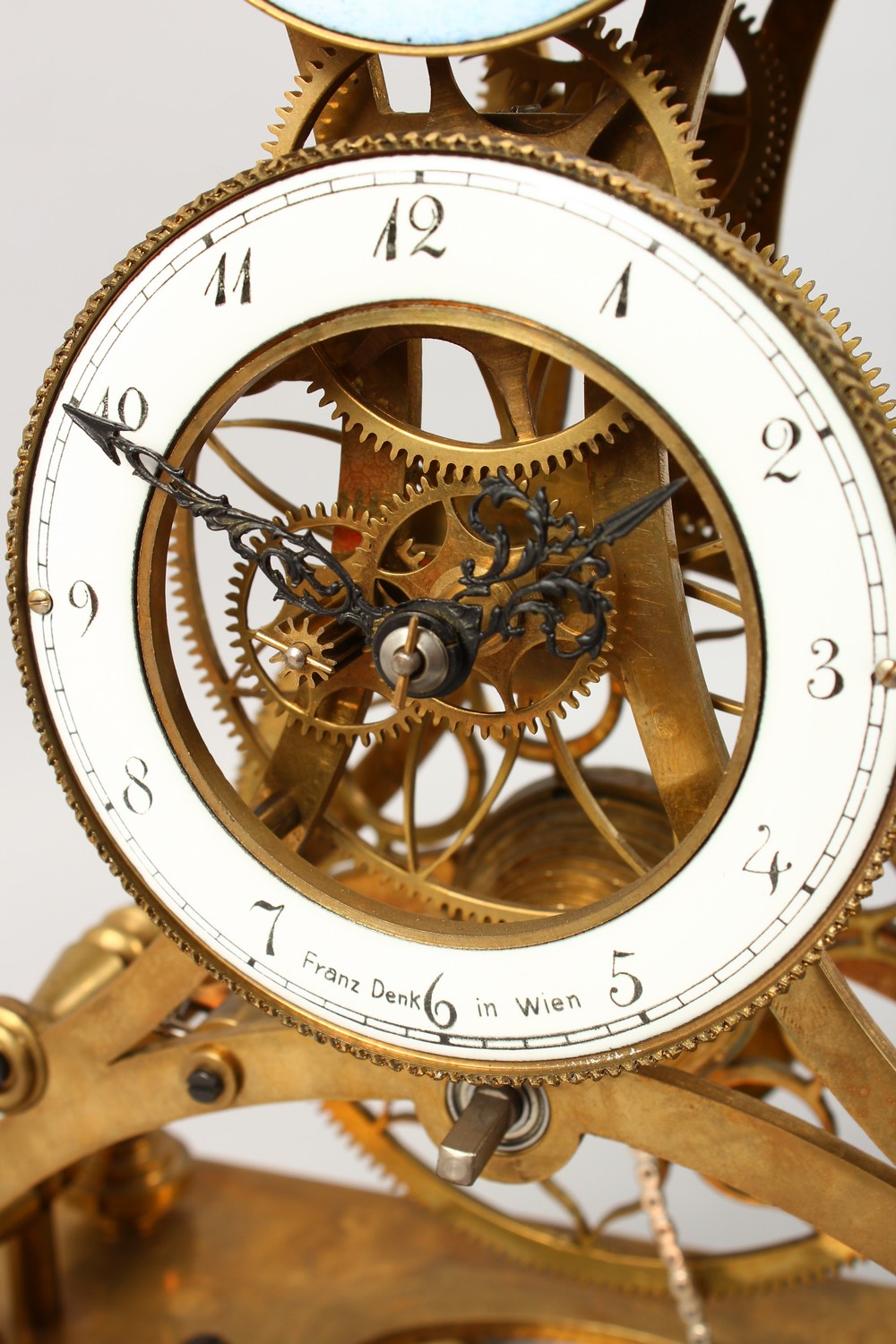 A MOON PHASE SKELETON CLOCK in a glass case. 17.5ins high including case. - Image 4 of 10