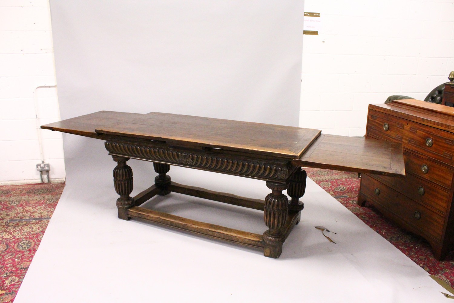 A GOOD 17TH/18TH CENTURY OAK DRAW LEAF TABLE, with a plain rectangular top, carved frieze on four - Image 6 of 9