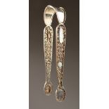 A PAIR OF FILIGREE SUGAR TONGS.