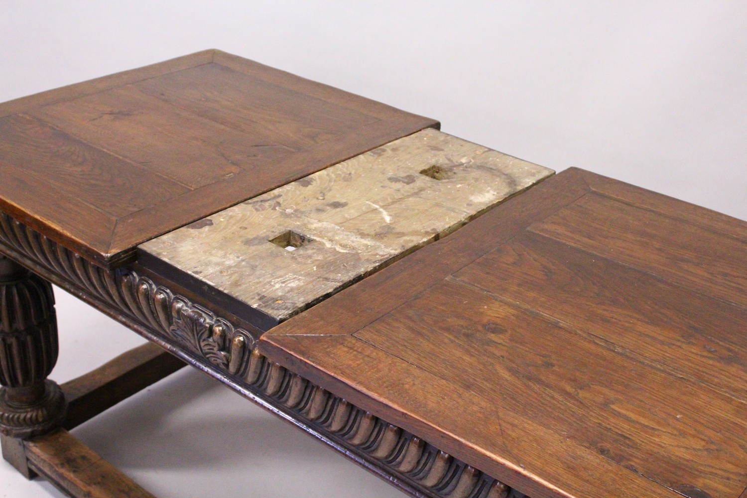 A GOOD 17TH/18TH CENTURY OAK DRAW LEAF TABLE, with a plain rectangular top, carved frieze on four - Image 9 of 9