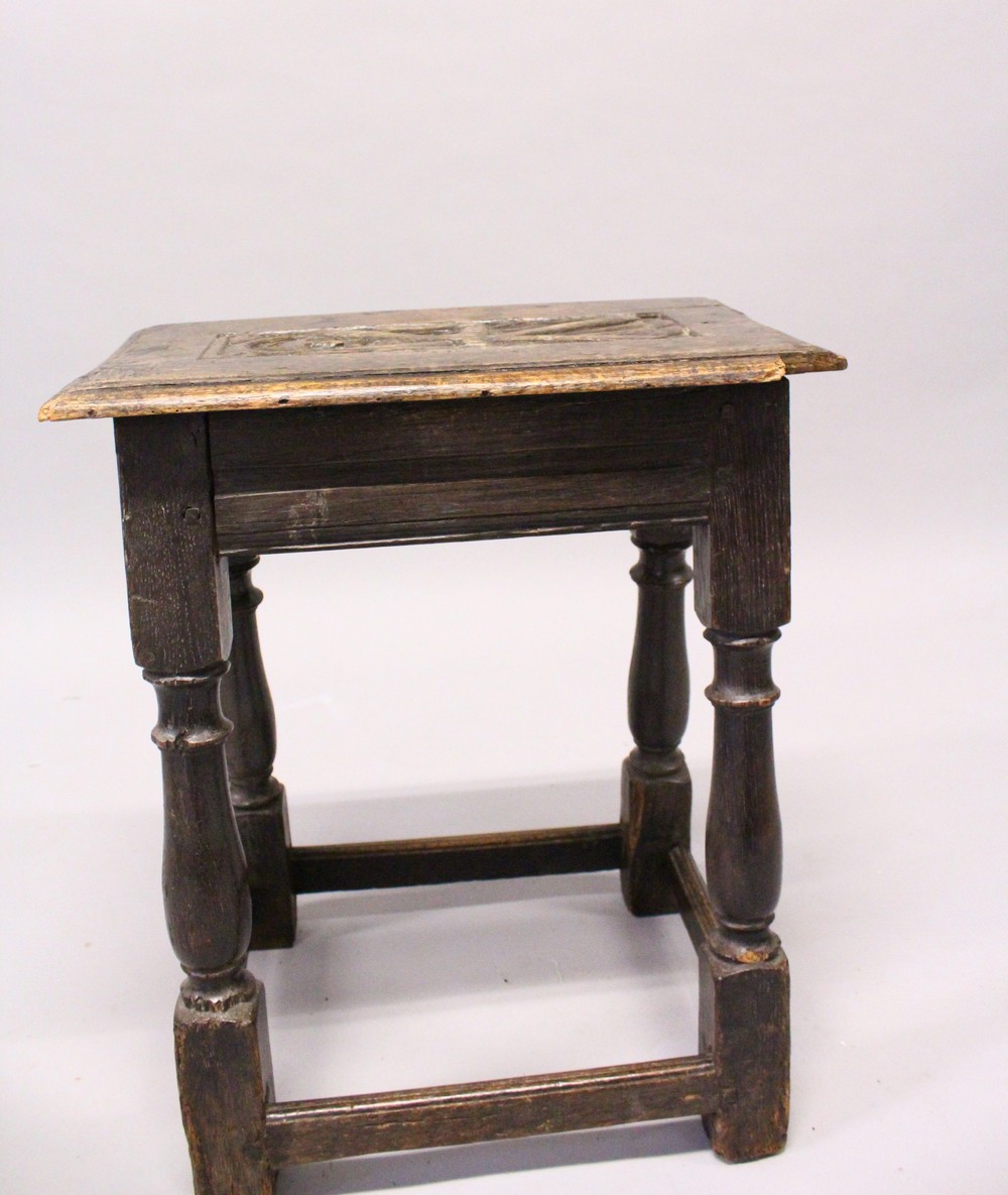 A 17TH/18TH CENTURY OAK JOINT STOOL, with plank top, carved with a male figure, fluted carved - Image 2 of 3