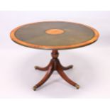 A REGENCY DESIGN CIRCULAR ROSEWOOD AND MAHOGANY LIBRARY TABLE, with green inset leather top, on a