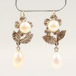 A NICE PAIR OF 9CT GOLD AND SILVER, PEARL AND ZIRCON DROP EARRINGS.