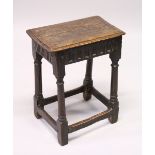 A 17TH CENTURY OAK JOINT STOOL, plank top with moulded edge, lunette carved frieze, on gun barrel