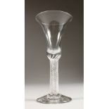 A LARGE GEORGIAN WINE GLASS, with multi air twist stem and inverted bell bowl. 7ins high.