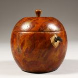 AN ORANGE TEA CADDY. 5ins high.