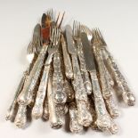A COMPOSITE SET OF VICTORIAN KNIVES AND FORKS, thirteen forks and eight knives, carving knife and