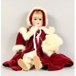 AN S.F.B.J. PARIS BISQUE HEADED DOLL, No. 301, wearing a velvet cloak. 26ins long.