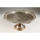 A LARGE CIRCULAR PEDESTAL FRUIT BOWL, with pierced and gadrooned edge and shell mounts. 12ins