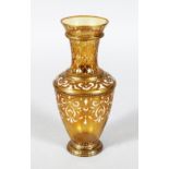 A MOSER AMBER GLASS VASE with enamel decoration. Signed. 7ins high.