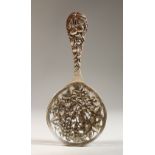 A CONTINENTAL SILVER PIERCED SPOON, decorated with fruit, strawberries and cherries.