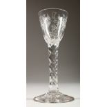 A GEORGIAN WINE GLASS, with facet stem , the bowl engraved with flower and bee. 6ins high.