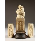 A 19TH CENTURY EUROPEAN CARVED IVORY MOTHER AND CHILD, the body opens to reveal a triptych, Christ