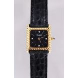 A LADIES SUPERB VAN CLEEF & ARPELS 18CT GOLD BLACK FACE WRISTWATCH, the face with four diamonds,