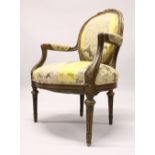 A 19TH CENTURY FRENCH CARVED, PAINTED AND PARCEL GILDED FAUTEUIL, supported on turned, tapering