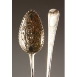 A PAIR OF GEORGE III BRIGHT CUT BERRY SPOONS. London 1799 and 1805.