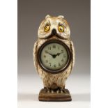 AN AUSTRIAN PAINTED METAL OWL CLOCK. 7ins high.