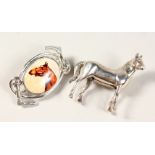TWO SILVER HORSE BROOCHES.