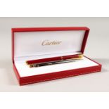 TWO CARTIER PENS, in a box with refills.