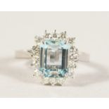 AN 18CT WHITE GOLD, AQUAMARINE AND DIAMOND CLUSTER RING of 2.5cts approx.