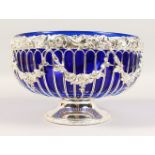 A GOOD BRISTOL BLUE GLASS CIRCULAR FRUIT BOWL, in a pierced plated frame. 11ins diameter.