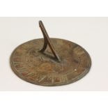 A BRONZE SUNDIAL. 6ins diameter.