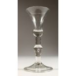A GEORGIAN WINE GLASS, with plain knop stem and inverted bell bowl. 6ins high.