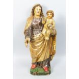AN 18TH CENTURY ITALIAN CARVED WOOD STANDING MADONNA AND CHILD. 23ins high.