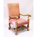 AN 18TH CENTURY STYLE WALNUT AND UPHOLSTERED ARMCHAIR, with scrolling arms, overstuffed seat on