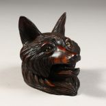 A SMALL CARVED BLACK FOREST FOXES HEAD INKWELL, with glass eyes. 3ins.