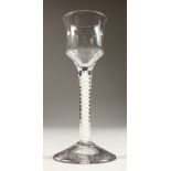 A GEORGIAN WINE GLASS, with cotton twist stem and fluted waisted bowl. 5.5ins high.