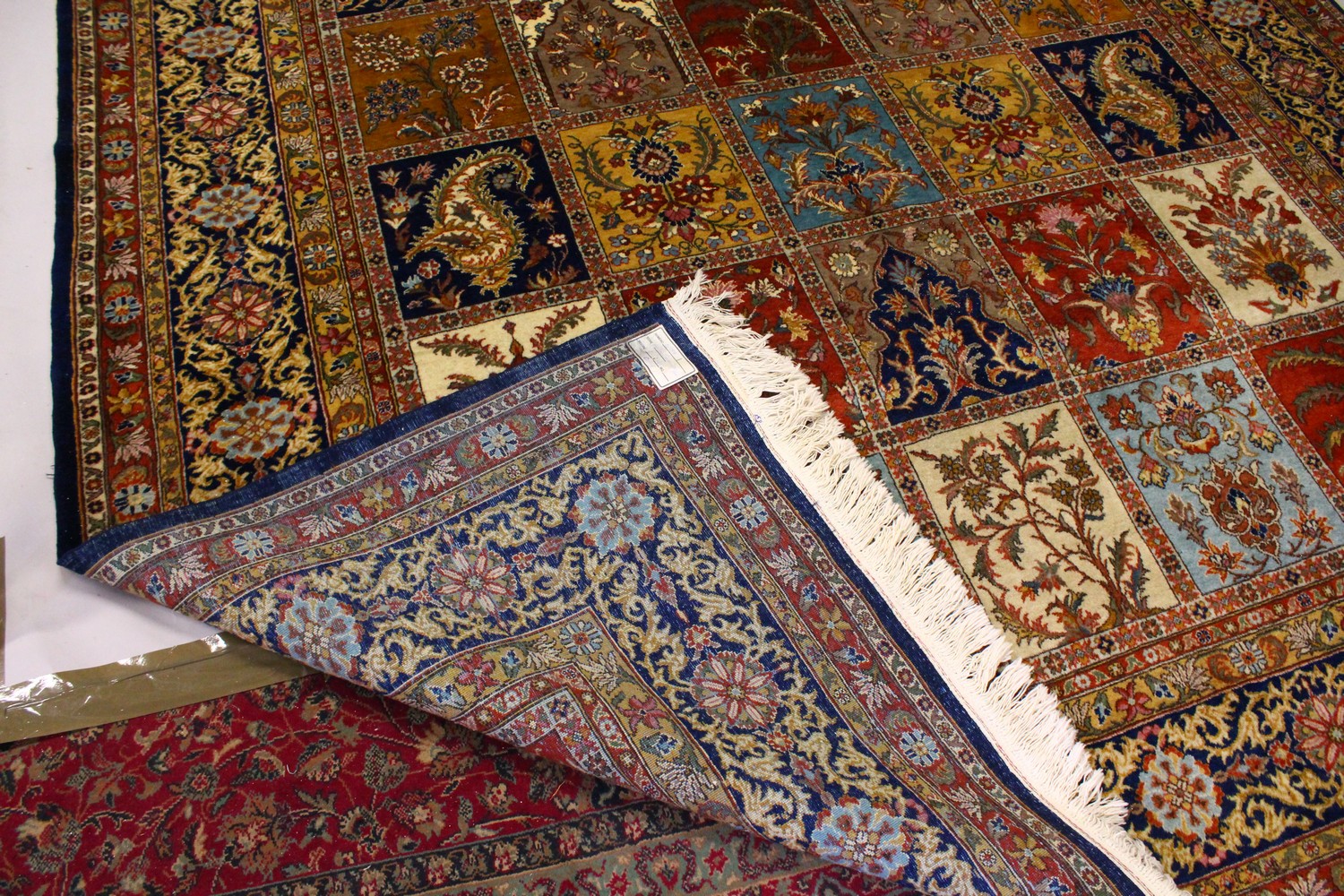 A VERY GOOD LARGE PERSIAN "GHOM" CARPET, the centre with seven rows of four floral motifs, varying - Image 9 of 10