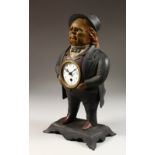 AN AMUSING PAINTED METAL STANDING FRAMED CLOCK. 15ins high.