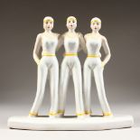 A DECO TYPE GROUP OF THREE SAILOR GIRLS. 11ins high.