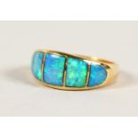 AN 18CT GOLD AND BLUE OPAL RING.