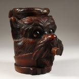 A CARVED BLACK FOREST HEAD OF A DOG SMOKING A CIGAR TOBACCO BOX. 8ins high.