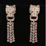 A PAIR OF SILVER MARCASITE RUBY SET PANTHER EARRINGS.