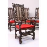 A VERY GOOD SET OF FOUR 17TH CENTURY WALNUT ARMCHAIRS, all with profusely carved cresting rails,