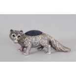 A SILVER FOX PIN CUSHION.