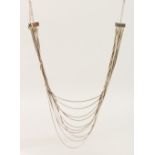 A SILVER TEN-ROW NECKLACE.