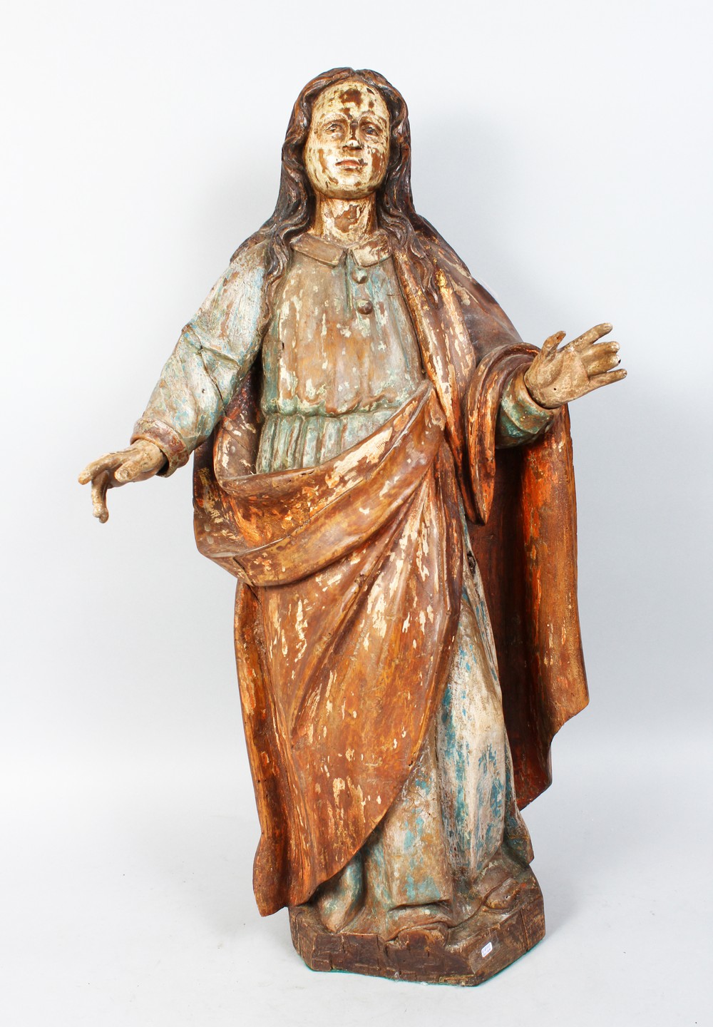 A 17TH-18TH CENTURY ITALIAN CARVED WOOD AND PAINTED FIGURES, arms outstretched. 28ins high.