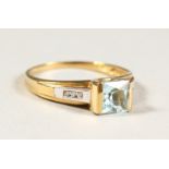 AN 18CT GOLD, AQUAMARINE AND DIAMOND RING.