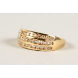 A 9CT GOLD TRIPLE ROW DIAMOND RING.