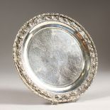 A CHINESE SILVER CIRCULAR WAITER. 6.5ins diameter.